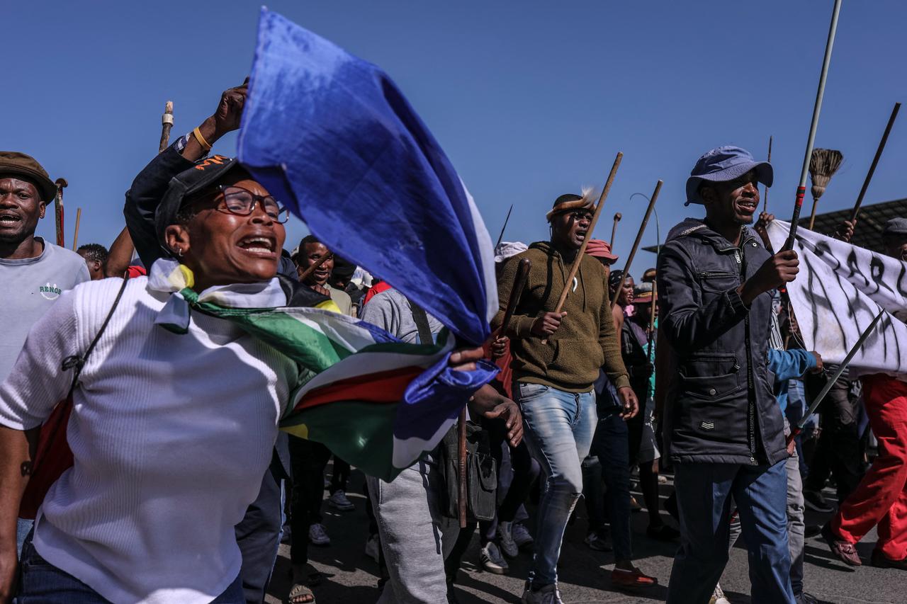 Protesters chant slogans during an anti immigrant march in Alexandra, on July 9, 2026. (AFP Photo)