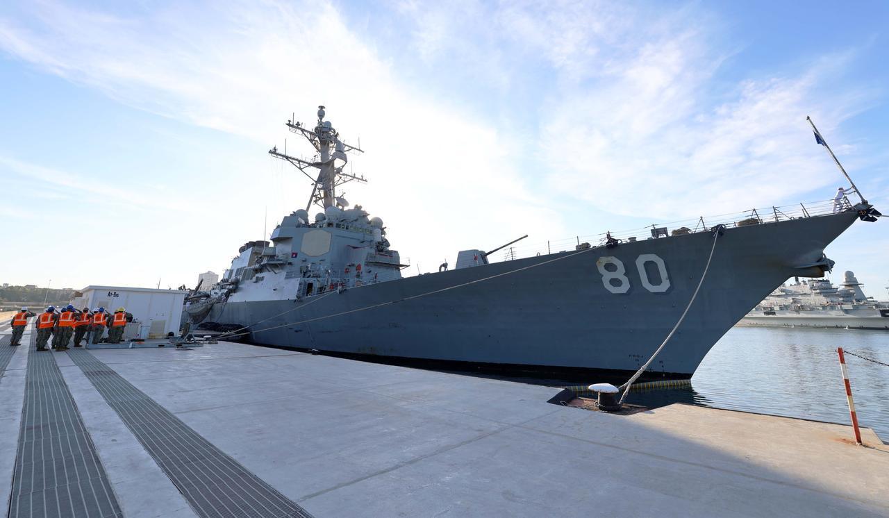 U.S. Navy Sailors render a hand salute during morning colors in front of the Arleigh Burke-class guided-missile destroyer USS Roosevelt (DDG 80) at Naval Station Taranto, Italy, Sept. 23, 2025. (Photo via U.S. Navy)