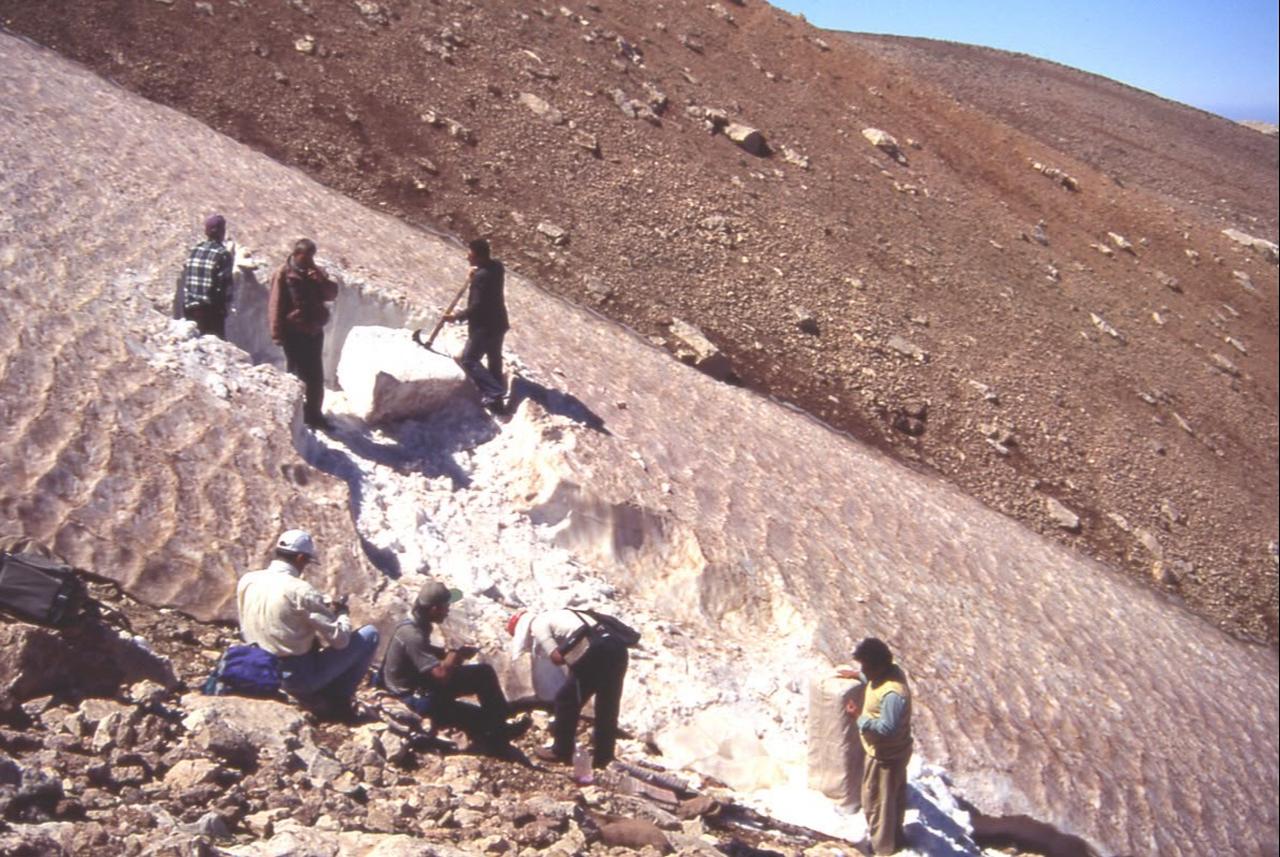 Workers collect compacted snow from a mountain slope as part of Anatolia’s fading snow well tradition, which supplied ice and snow for summer cooling. (IHA Photo)