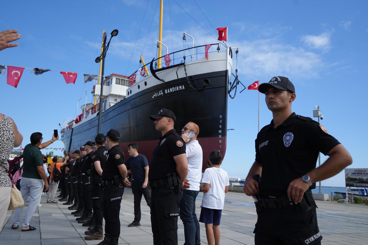 Police officers stand guard as the Bandirma Ferry Museum reaches its new site near Tutun Pier in Samsun, Türkiye, July 12, 2026. (IHA Photo)