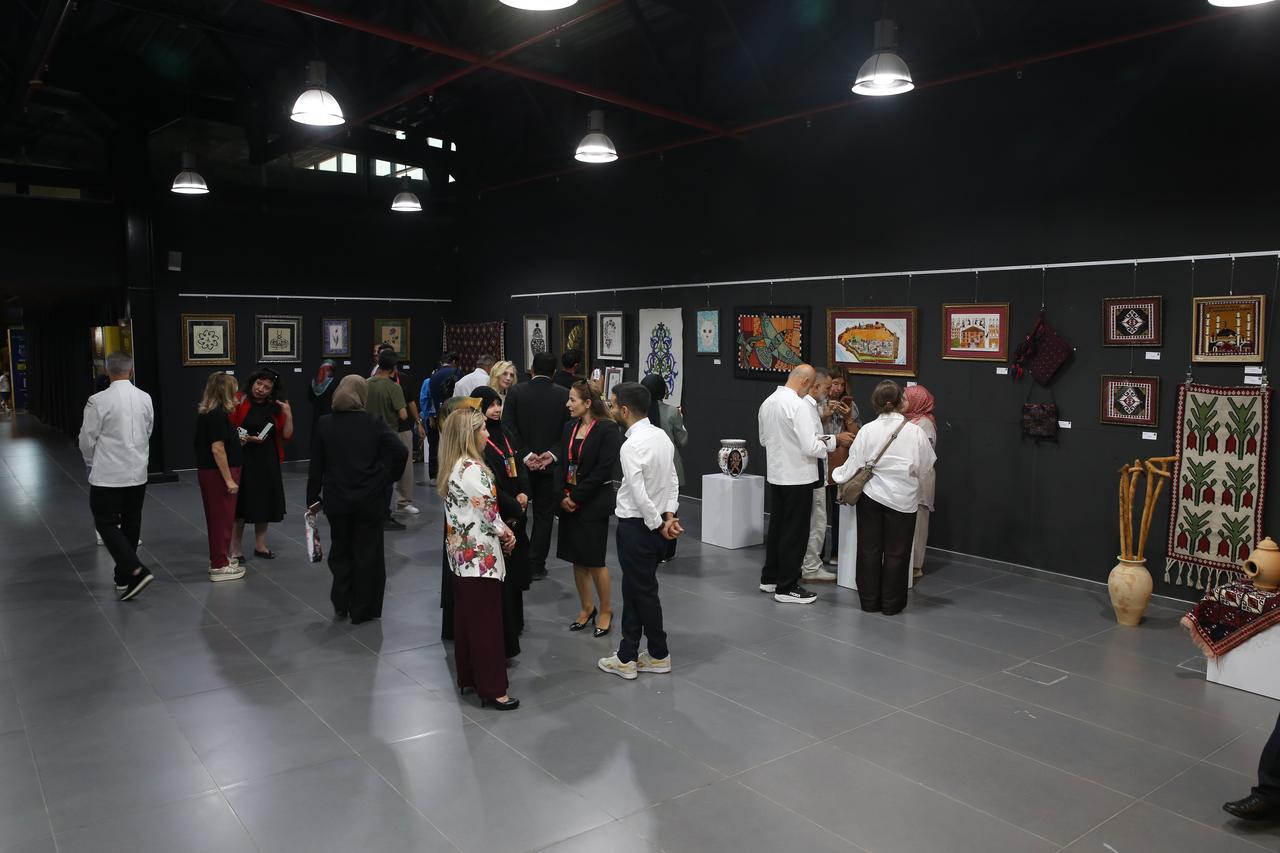 Guests tour an exhibition hall featuring traditional artworks and cultural objects as the Türkiye Culture Route Festival opens in Van. (AA Photo)