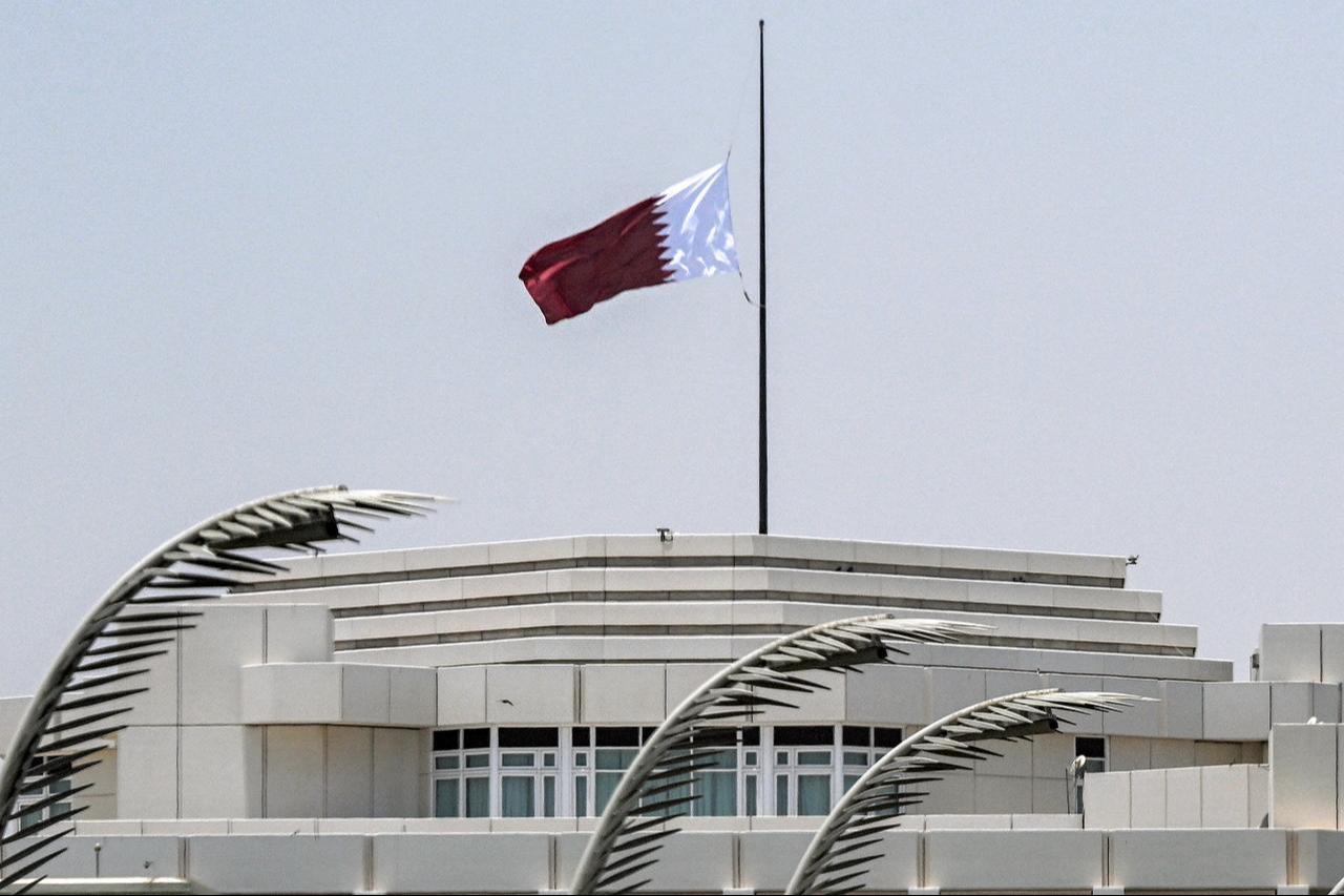 Qatar's flag flies at half-mast above the Amiri Diwan headquarters in Doha on July 12, 2026 following the announcement of the death of the state's former emir, Sheikh Hamad bin Khalifa Al-Thani who led the country from 1995 to 2013. (AFP Photo)