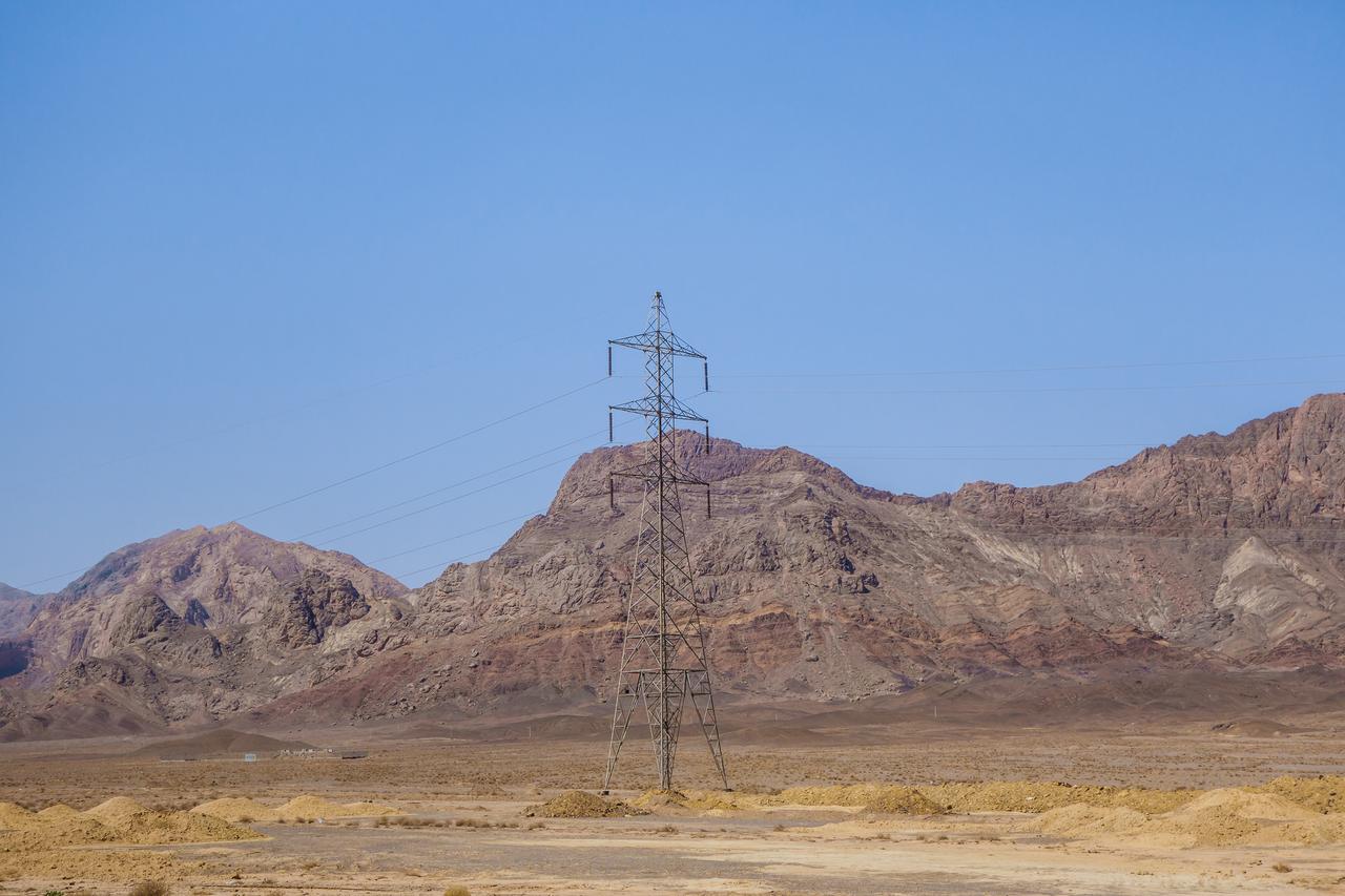 A power transmission tower stands in Iran's Yazd province. (Adobe Stock Photo)