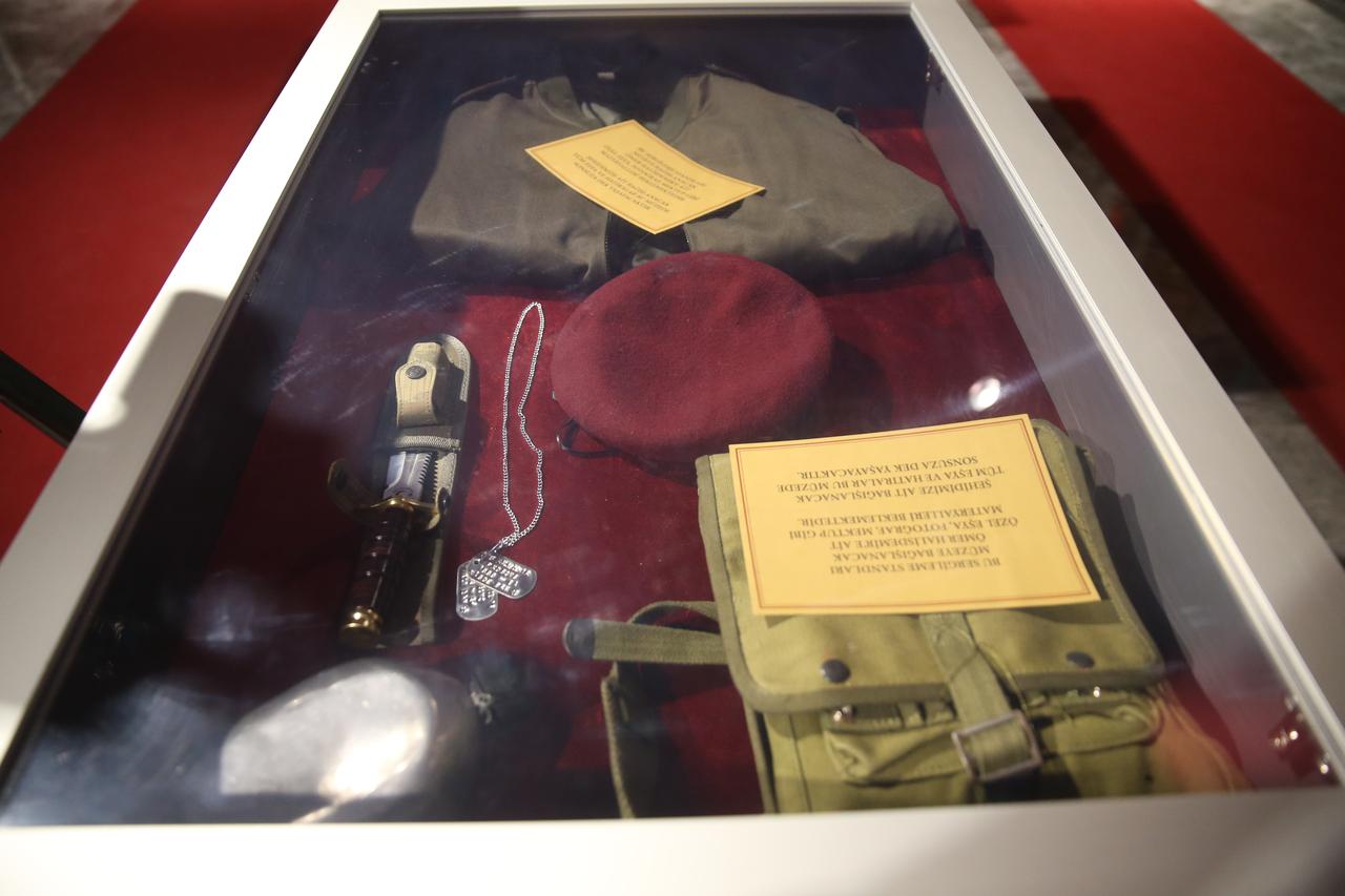 Personal belongings of July 15 hero Omer Halisdemir, including his beret, clothes, knife, canteen and military identity tags, are displayed at the Sehit Omer Halisdemir Culture Center in Nigde, Türkiye. (AA Photo)