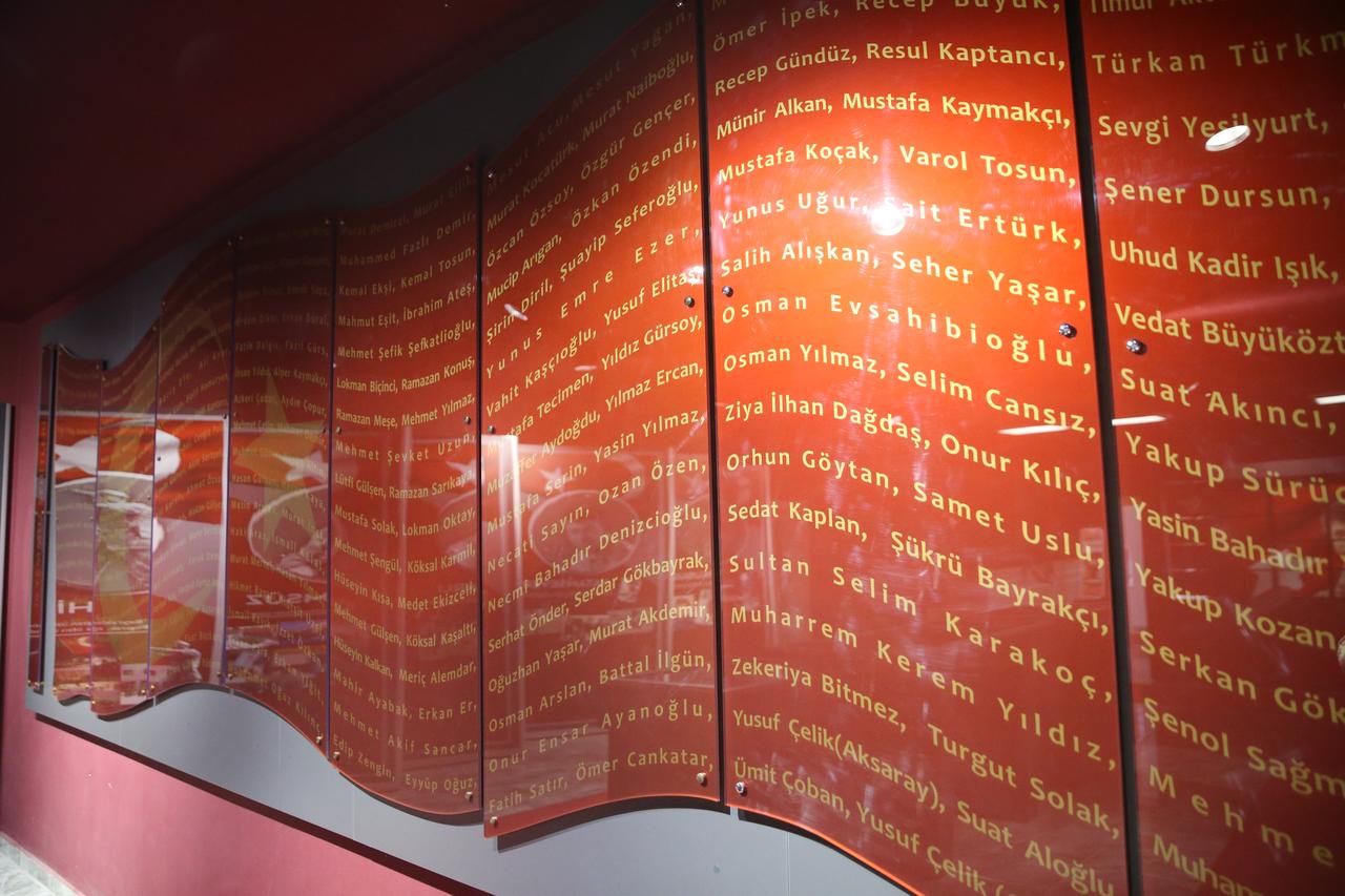 The names of those killed during the July 15 coup attempt are displayed on red panels inside the Sehit Omer Halisdemir Culture Center in Nigde. (AA Photo)