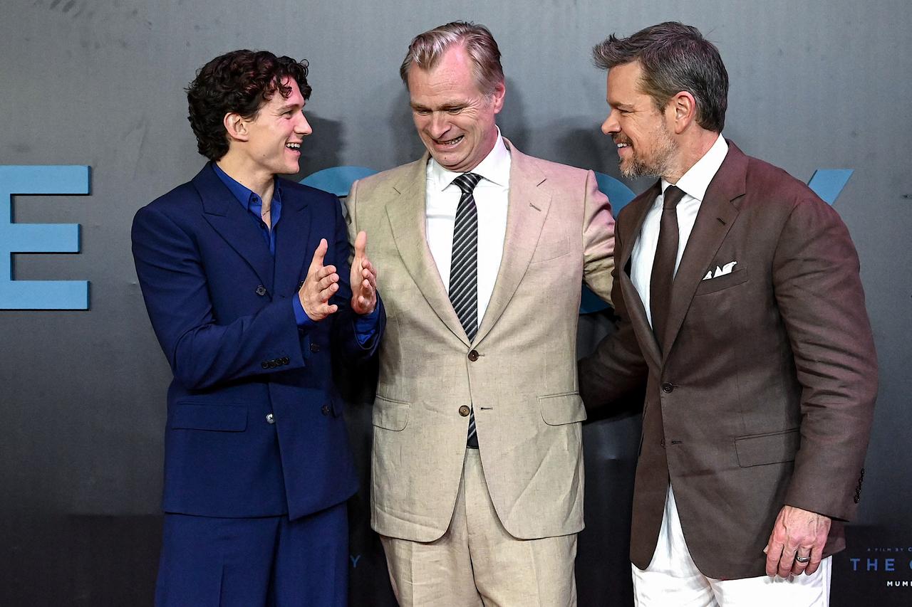 (L-R) English actor Tom Holland, British-American filmmaker Christopher Nolan and US actor Matt Damon attend the red carpet for the premiere of their film 'The Odyssey' in Mumbai on July 11, 2026. (AFP Photo)