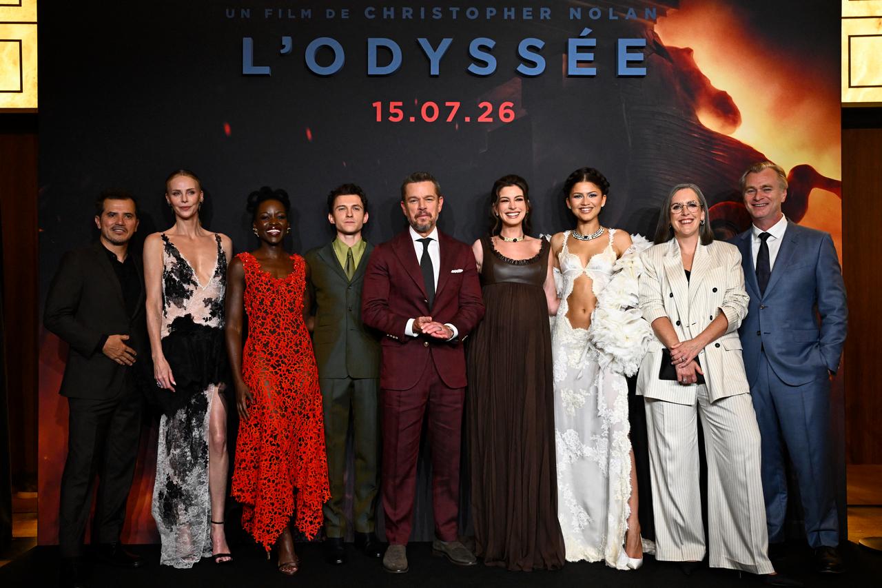 John Leguizamo, Charlize Theron, Lupita Nyong'O, Tom Holland, Matt Damon, Anne Hathaway, Zendaya,  Emma Thomas and Christopher Nolan pose during a photocall ahead of the premiere of the film 'The Odyssey' at the Grand Rex in Paris on July 8, 2026. (AFP Photo)