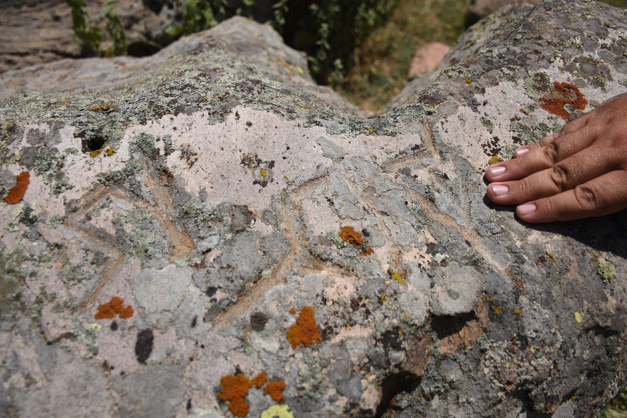 A close-up shows runic markings carved into a rock block at the Binbirkilise site in Karaman, central Türkiye, where researchers say the inscription may point to an early Turkic tribal mark. (AA Photo)