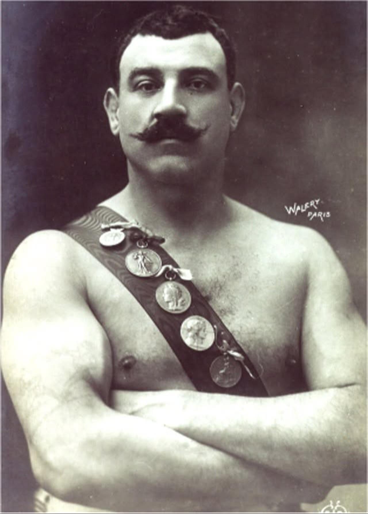 French Greco-Roman wrestling champion Paul Pons poses with medals earned during his career in the late 19th and early 20th centuries. (Photo via Facebook/Andrea Renzi)