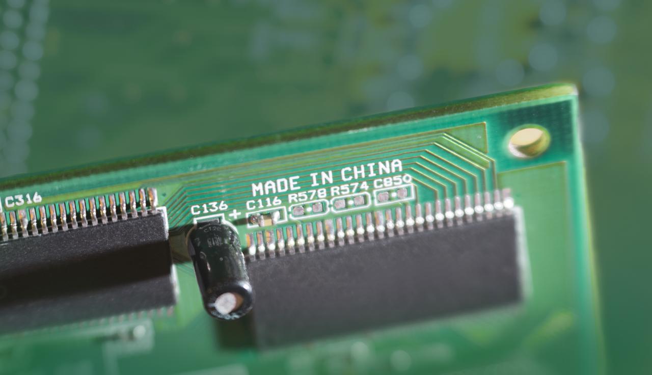 A close-up of a printed circuit board labeled "Made in China." (Adobe Stock Photo)