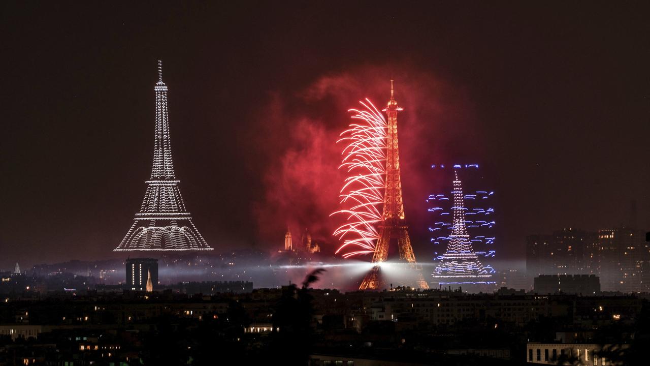 Fireworks and drones light up Paris skyline eve of Bastille Day