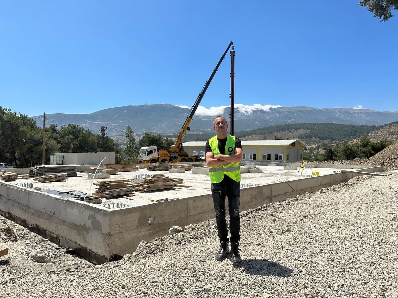 Haluk Levent stands at the construction site of a project intended to support university students studying and living in the earthquake-affected Hatay region, Türkiye, in a photo shared on July 7, 2023. (Photo via X/@haluklevent)