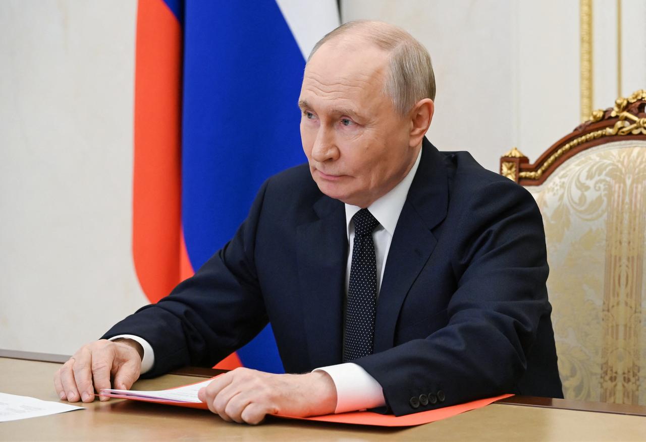 In this pool photograph distributed by the Russian state agency Sputnik, Russia's President Vladimir Putin chairs a Security Council meeting via videolink in Moscow, July 10, 2026. (Sputnik/HO/AFP)