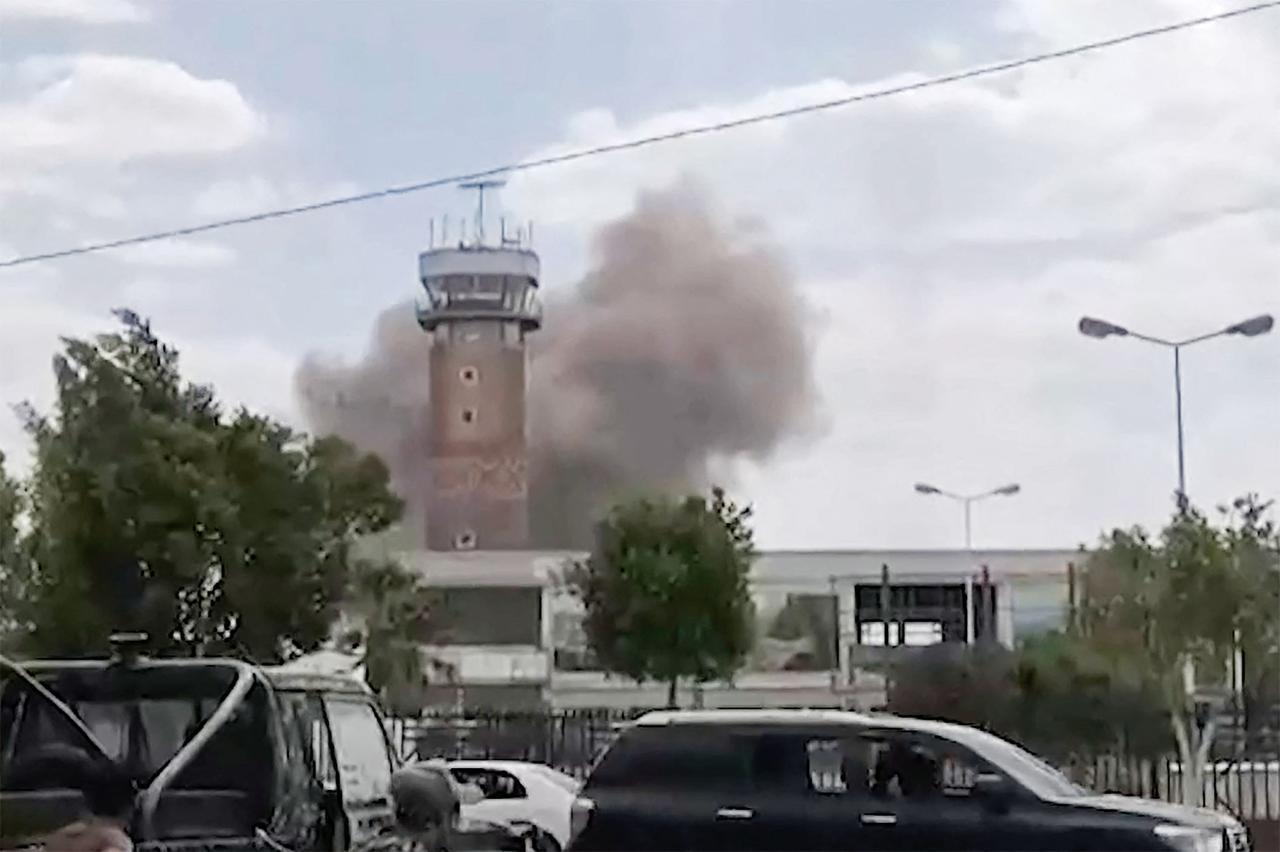 This screen grab taken from a video footage released by the Al-Masirah TV and made available via AFPTV on July 13, 2026 shows smoke rising from the airport in Sanaa. (AFP Photo/Al-Masirah via AFPTV/HO)