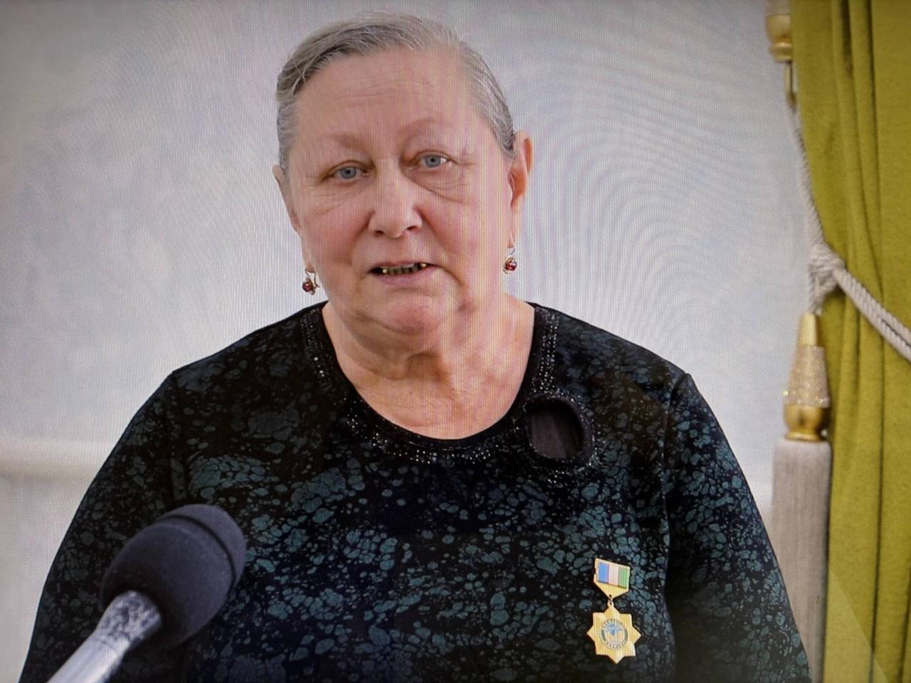 Tatyana Alekseyevna Sobirova, who worked at the Takhiatash thermal power plant for 38 years, poses for a photograph in Takhiatash, Karakalpakstan, Uzbekistan. (Photo courtesy of the Information Service of the Takhiatash District Administration)
