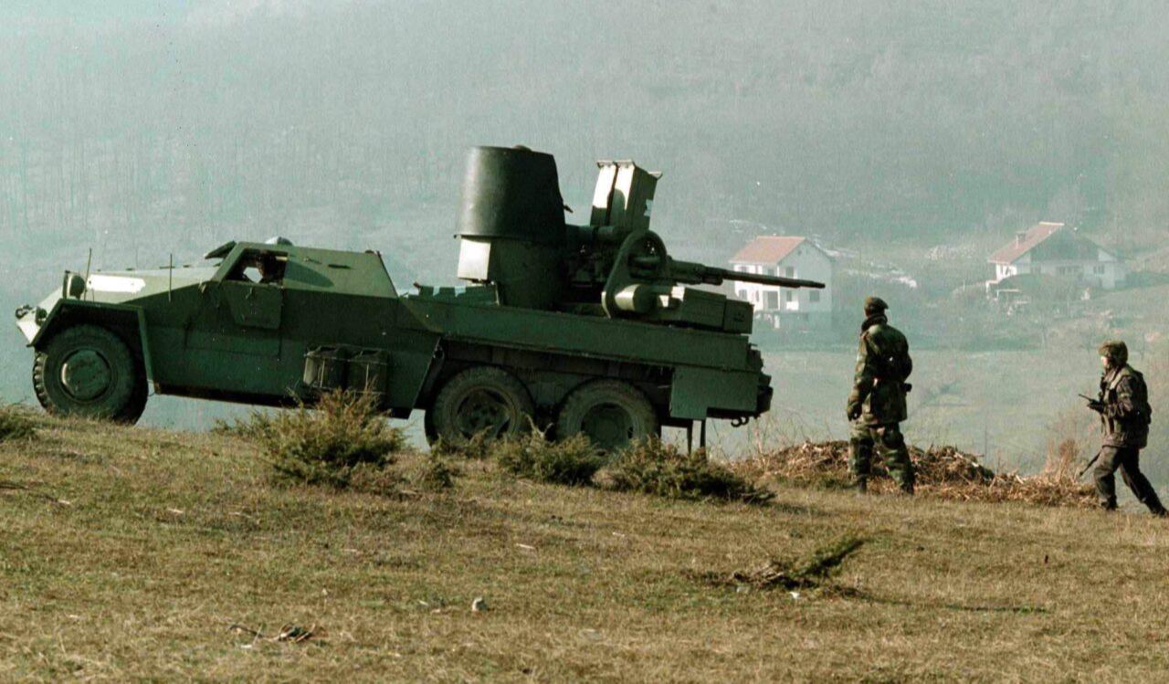 Serb military forces take up their positions opposite the village of Racak, site of last Friday's massacre, near Stimlje some 25km south of Pristina 18 January 1999.  (EPA Photo via Balkan Insight)