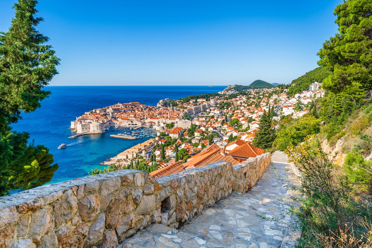 Panoramic view of the old town of Dubrovnik in Croatia on the shores of the Adriatic Sea. (Photo via Adobe Stock)
