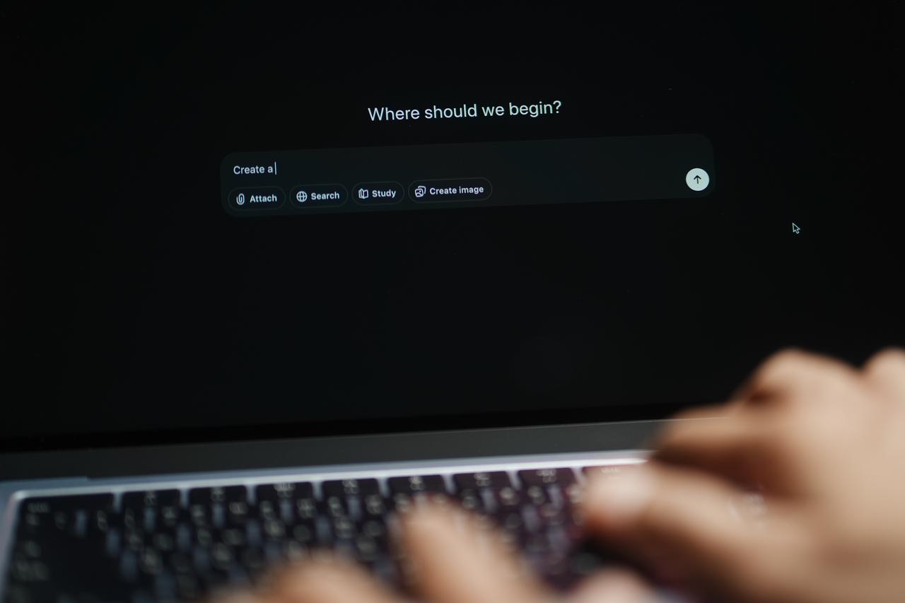 The hands of a man using a laptop inputting commands and interacting with chat GPT. (Photo via Adobe Stock)