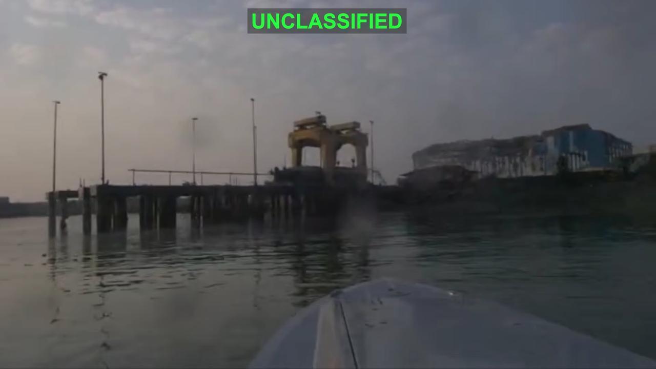 An unclassified video showed a US military explosive drone boat exploding an Iranian naval facility where a midget submarine is suspended from a gantry. (via US Central Command)