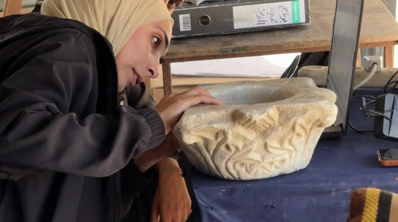 Volunteers inspect ancient artifacts in Gaza on July, 11, 2026. (AFP Photo)