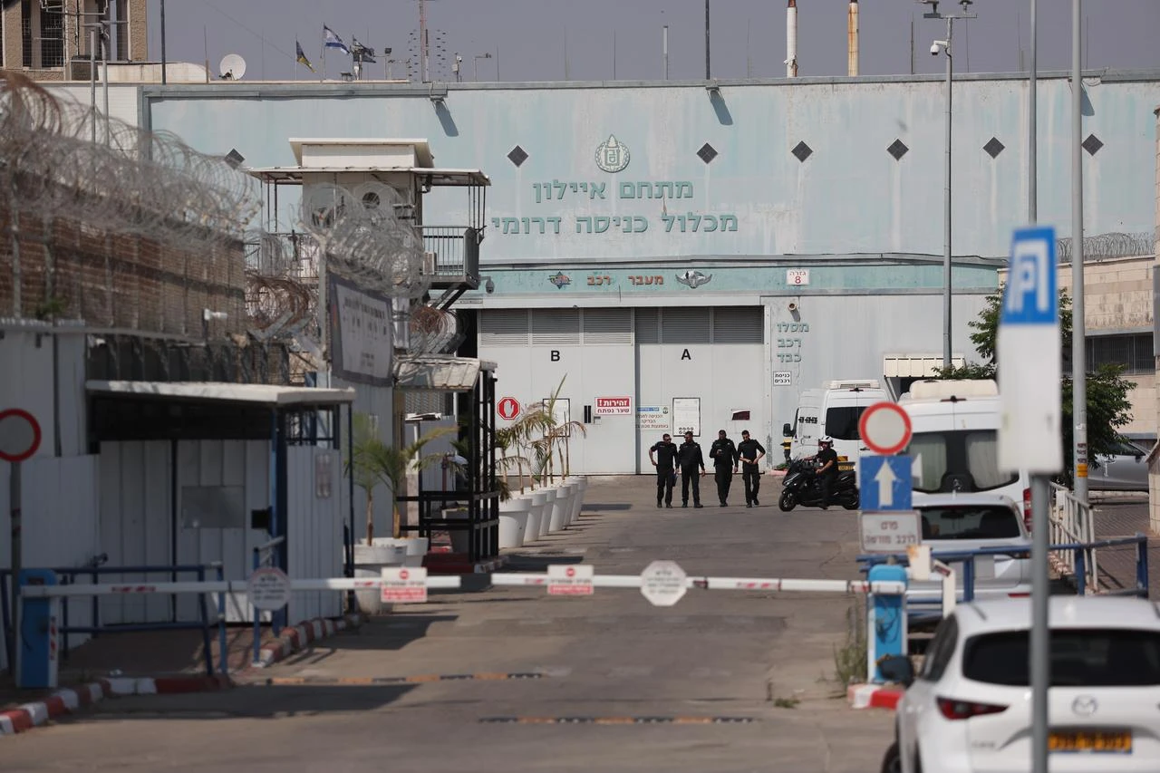 Personnel from the French Embassy in Tel Aviv wait outside Givon Prison facility in the city of Ramla, Israel on June 10, 2025. (AA Photo)