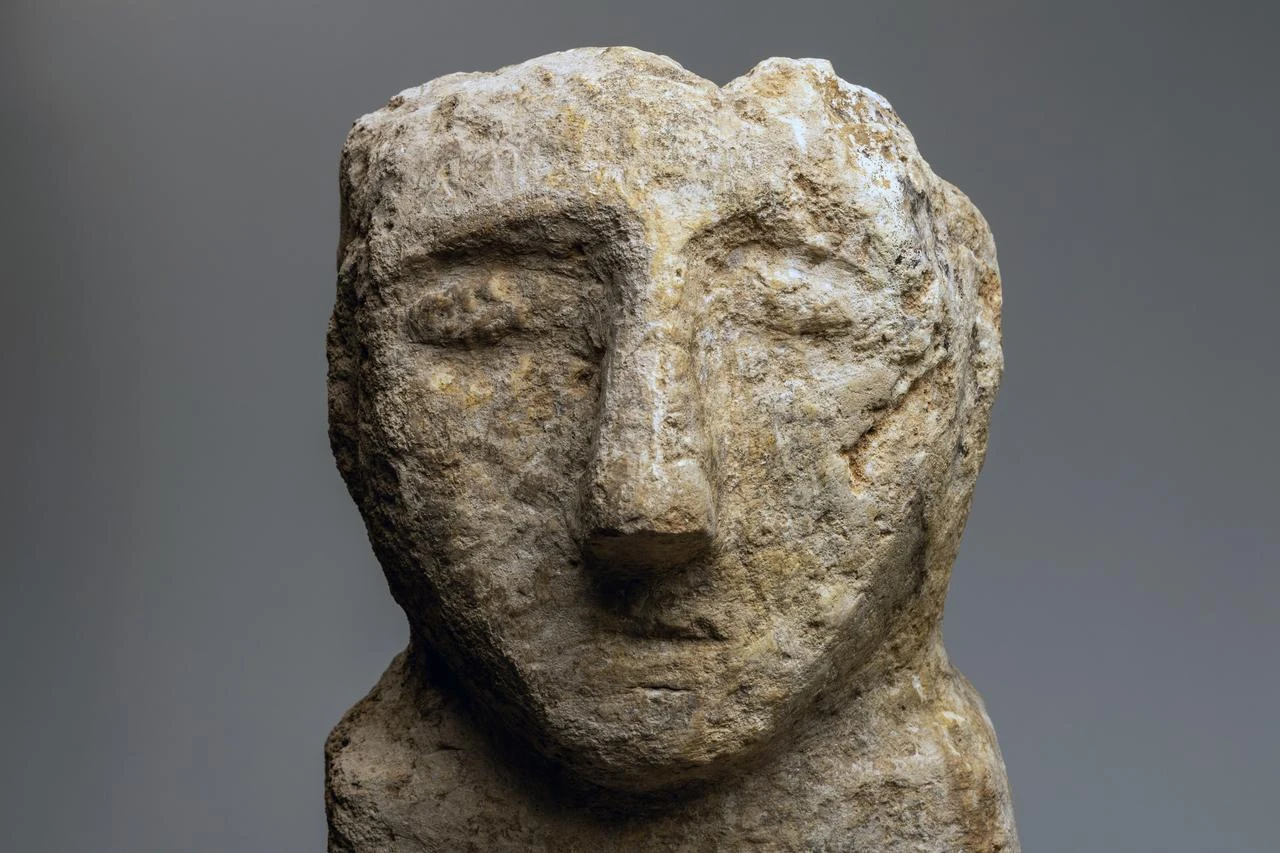 A limestone human statue from Göbeklitepe, dating to 9,600–8,200 BCE. (Photo by Yusuf Aslan, courtesy of Şanlıurfa Museum)