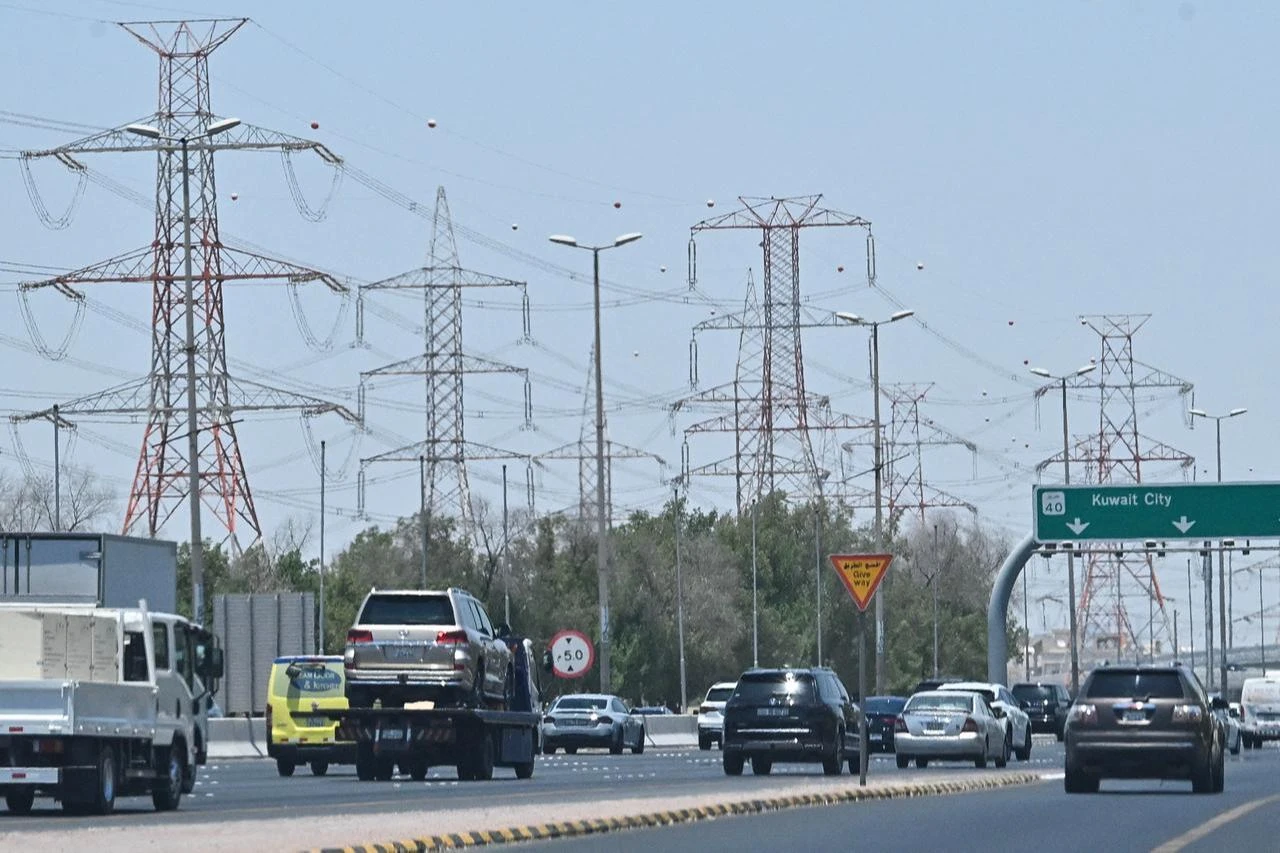 Vehicles drive along a highway on the outskirts of Kuwait City on July 8, 2026. (AFP Photo)
