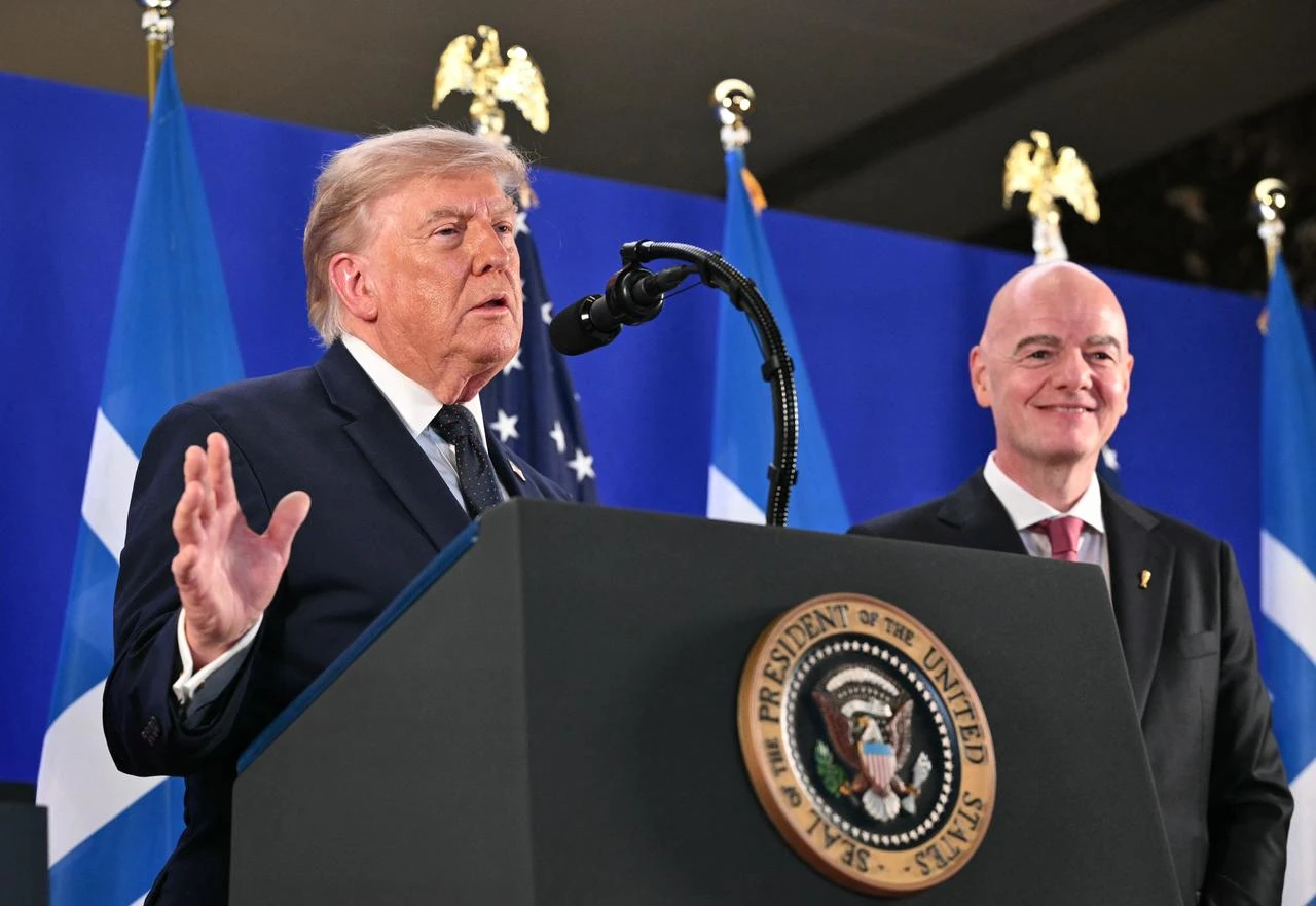 FIFA President Gianni Infantino (R) listens to US President Donald Trump speak during a FIFA reception at Trump Tower in New York on July 17, 2026. (AFP Photo)