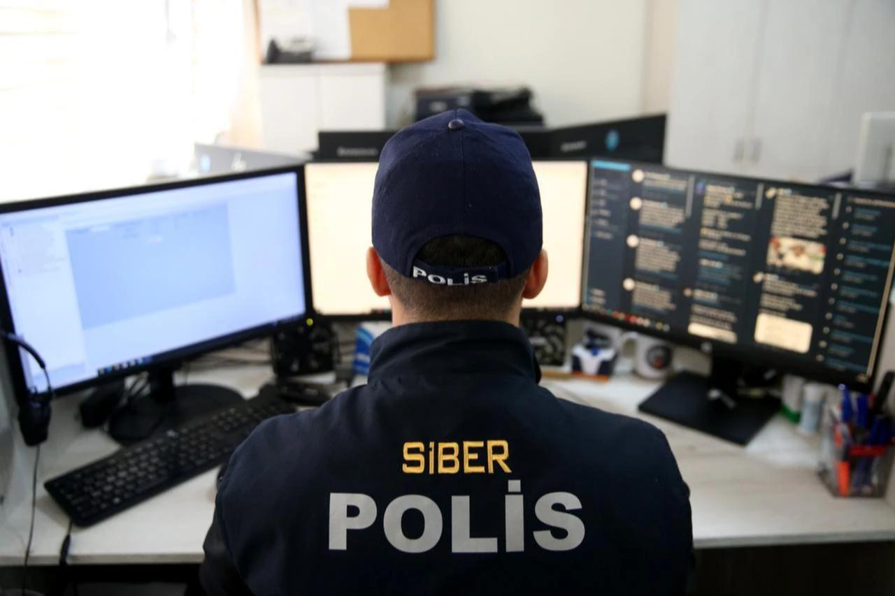 File photo shows a police officer from the Cybercrime Unit of the Security Directorate. (AA Photo)