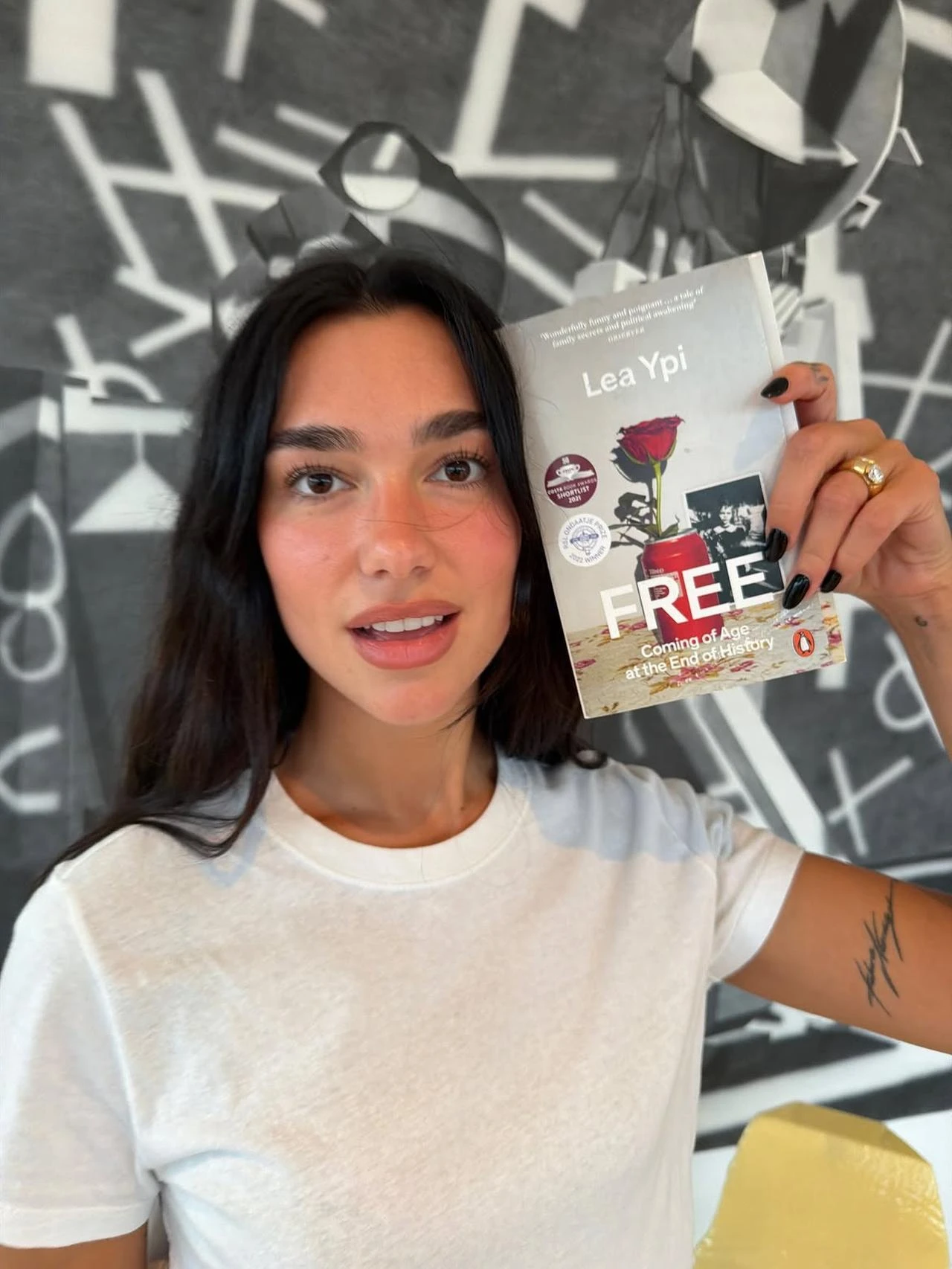 The photo shows global pop star Dua Lipa, one of the Balkans' most recognizable cultural ambassadors, holding Lea Ypi's 'Free' book, in July 2026. (Photo via Instagram/@dualipa)