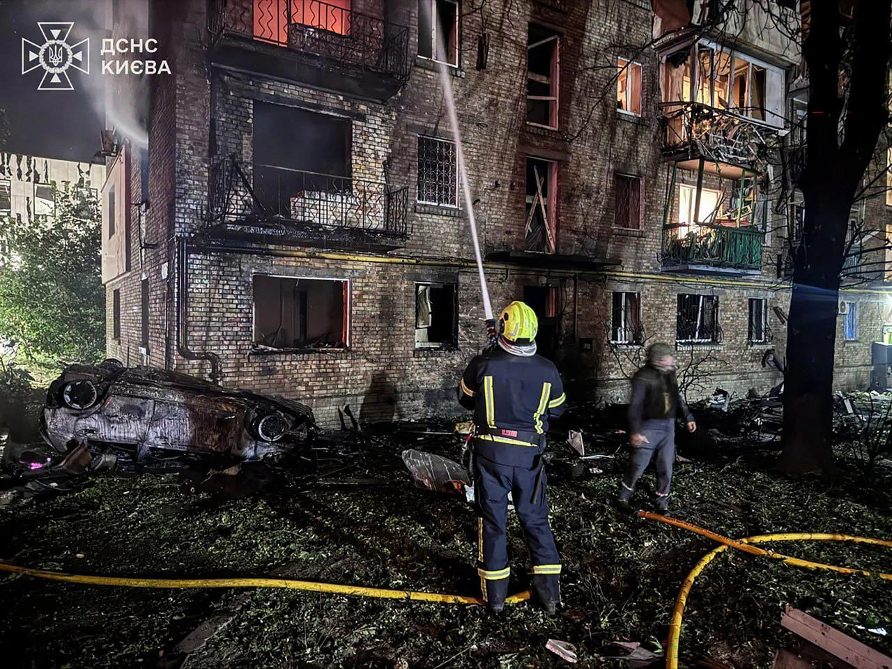 This handout photograph taken and released by Ukrainian State Emergency Service on July 19, 2026 shows rescuers putting out a fire in a residential building following Russian missile strikes on the Ukrainian capital of Kyiv, amid the Russian invasion in Ukraine. (AFP Photo)