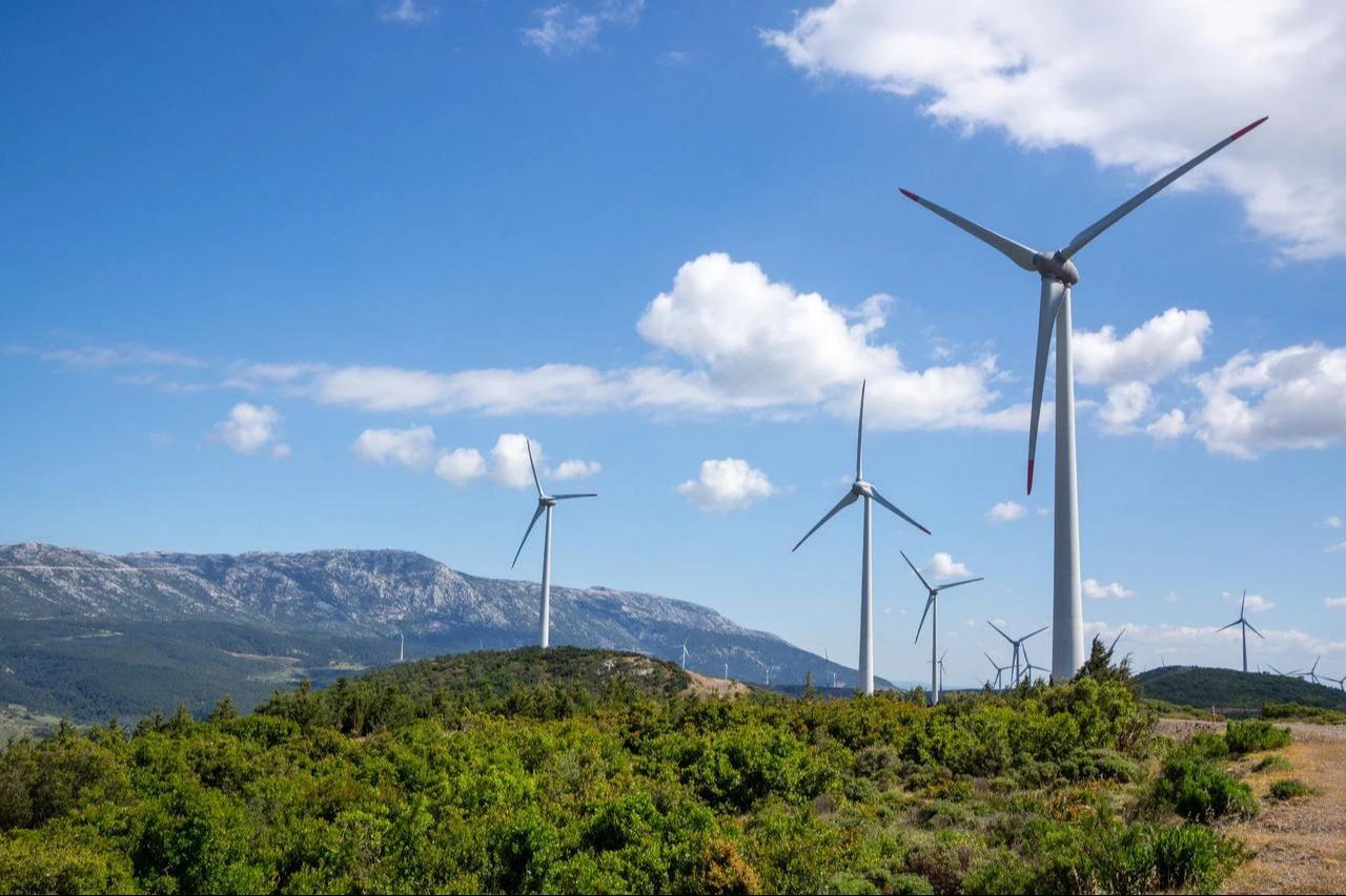 Wind turbines generate electricity at a wind farm in the hills of Izmir, Türkiye. (Adobe Stock Photo)