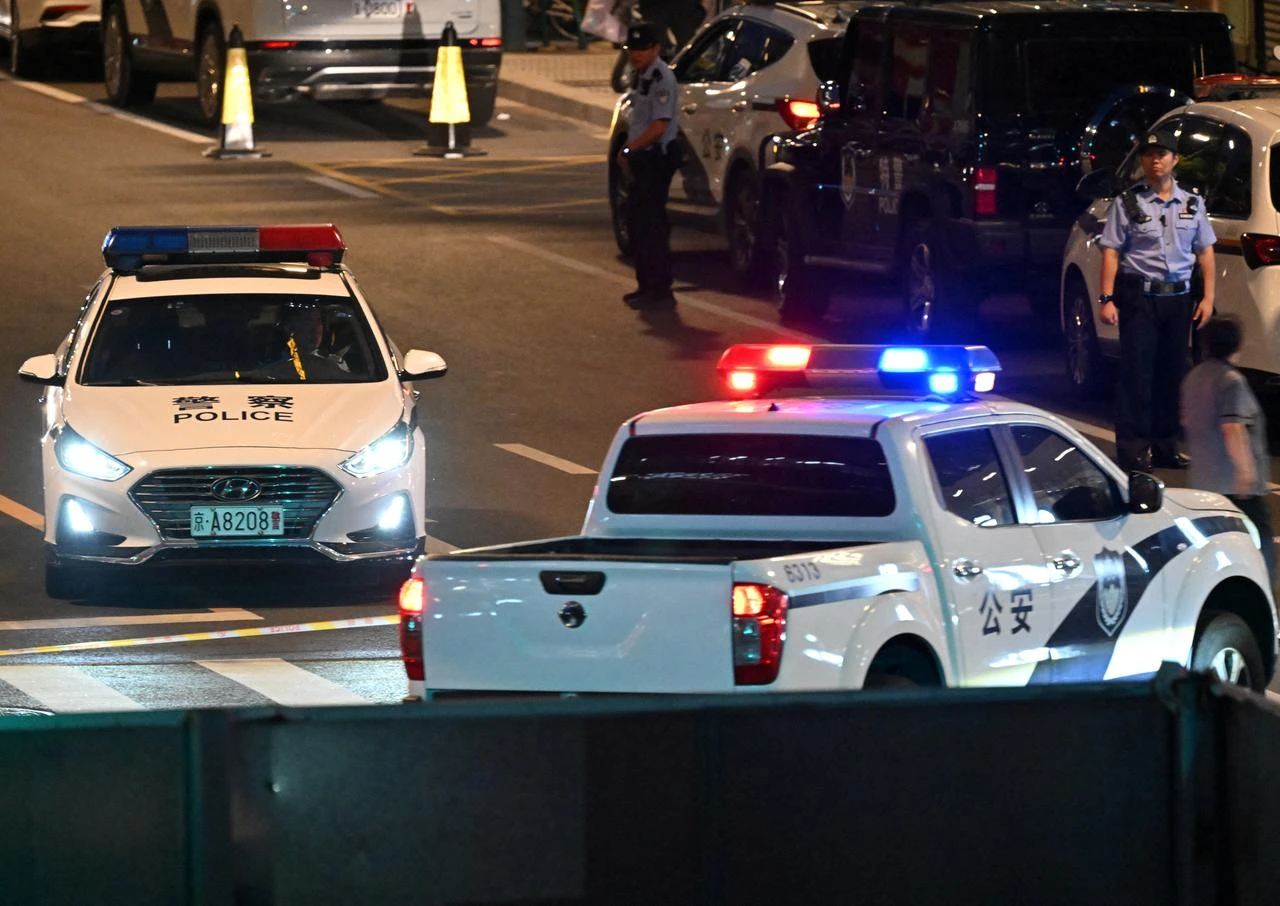 Police personnel block the road near the CITIC Tower in Beijing on June 26, 2026, after an eyewitness reported plane debris at the base of Beijing's tallest building. (AFP Photo)