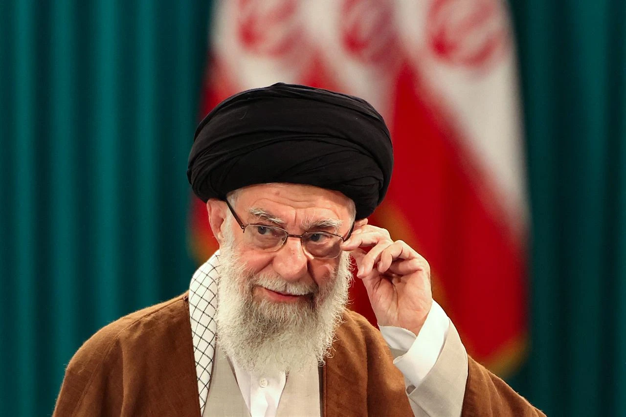 Iran's Supreme Leader Ayatollah Ali Khamenei adjusts his eyeglasses during a press conference after casting his ballot for the parliamentary runoff elections in Tehran on May 10, 2024. (AFP File Photo)