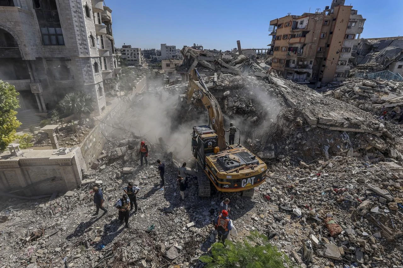 Civil defense teams work to recover the bodies of Palestinians trapped under the rubble of a building destroyed in Israeli attacks on the Rimal neighbourhood in Gaza City, Gaza, Palestine on June 30, 2026. (AA Photo)