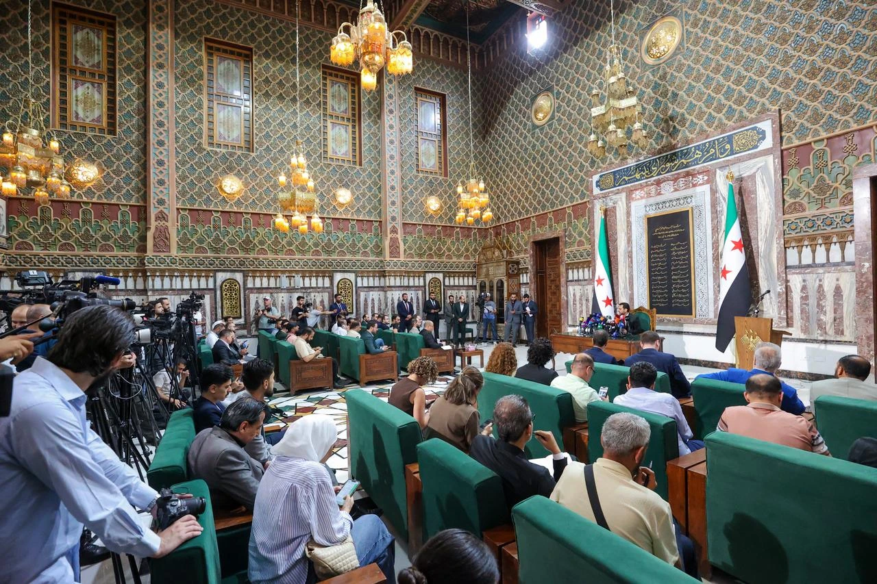 Muhammad Taha al-Ahmad, Head of the People's Assembly Supreme Election Committee, announced the names of the 70 individuals appointed by Syrian President Ahmad al-Shara, 1 July 2026. (Anadolu Agency photo)
