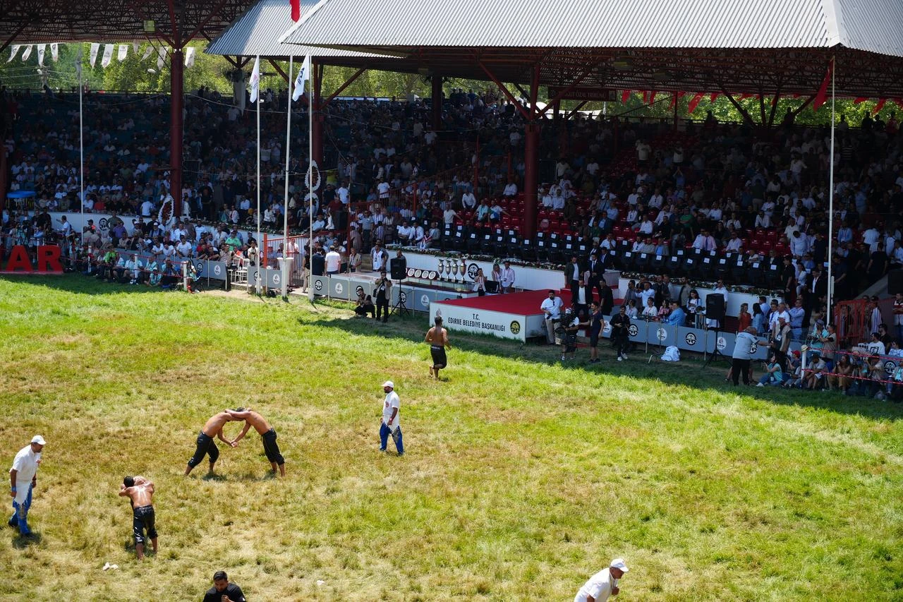 A general view shows oil wrestlers competing before packed stands during the 2025 Historic Kirkpinar Oil Wrestling in Edirne, Türkiye. (IHA Photo)