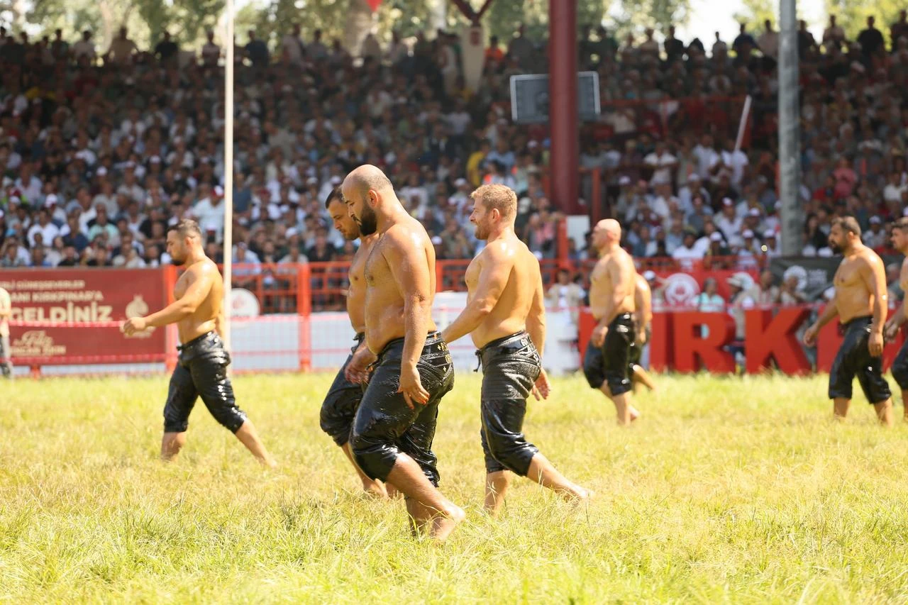 Oil wrestlers walk across the field during the 2025 Historic Kirkpinar Oil Wrestling in Edirne, Türkiye. (IHA Photo)