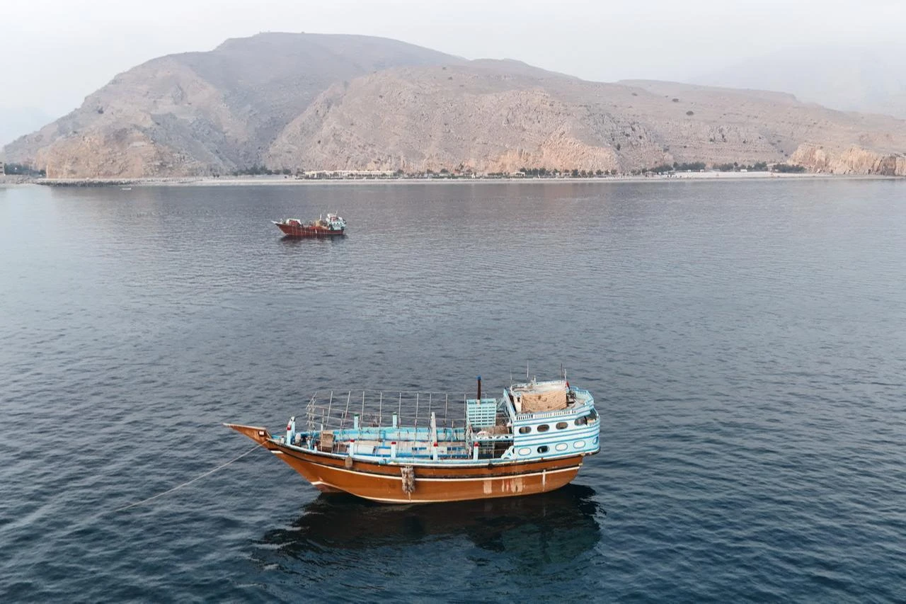This aerial photograph shows boats anchored off Oman’s northern Musandam Peninsula near the Strait of Hormuz on June 27, 2026. (AFP Photo)