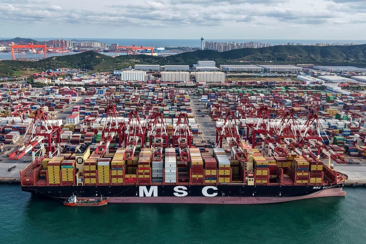 An aerial view shows a cargo ship berthed at the port in Qingdao, in China's eastern Shandong province, October 29, 2025. (AFP Photo)