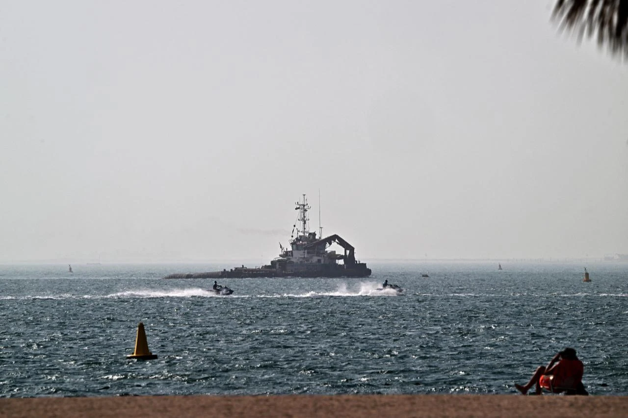 A vessel is seen off the coast of Dubai on July 15, 2026. (AFP Photo)