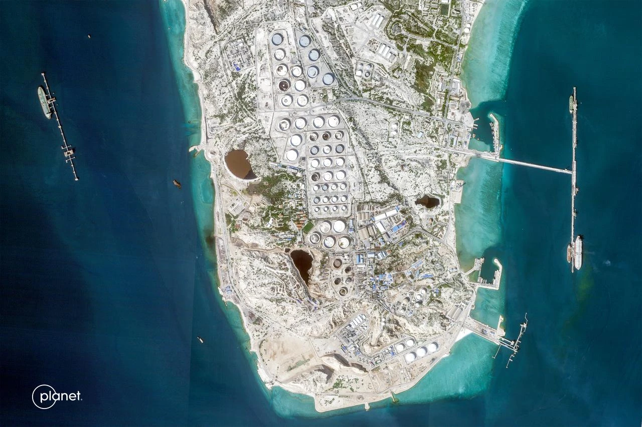 This handout satellite image taken by 2026 Planet Labs PBC shows a view of Iran's Kharg Island, which hosts the country’s main crude export terminal and is responsible for the overwhelming majority of its oil shipments to the world, Feb. 22, 2026. (Photo by 2026 Planet Labs PBC/AFP)