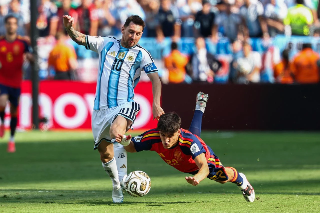 Lionel Messi fouls Pau Cubarsi during the 2026 World Cup football tournament final match between Spain and Argentina at the New York/New Jersey Stadium in East Rutherford on July 19, 2026.  (AFP Photo)