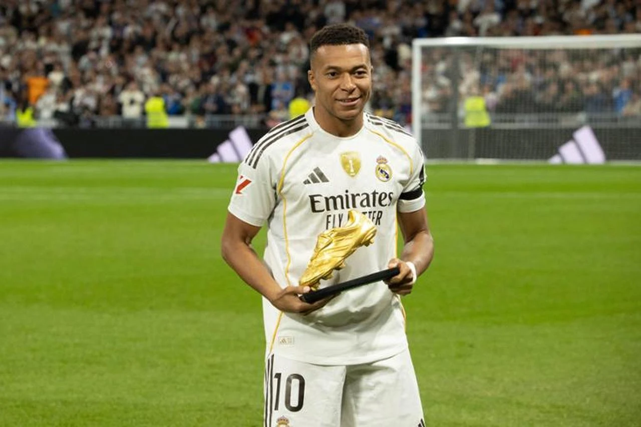 Kylian Mbappe of Real Madrid CF poses for photo with the Golden Boot trophy during the Spanish championship LaLiga football match between Real Madrid and Valencia CF on 1 November 2025 at Santiago Bernabeu stadium in Madrid, Spain. (AFP Photo)