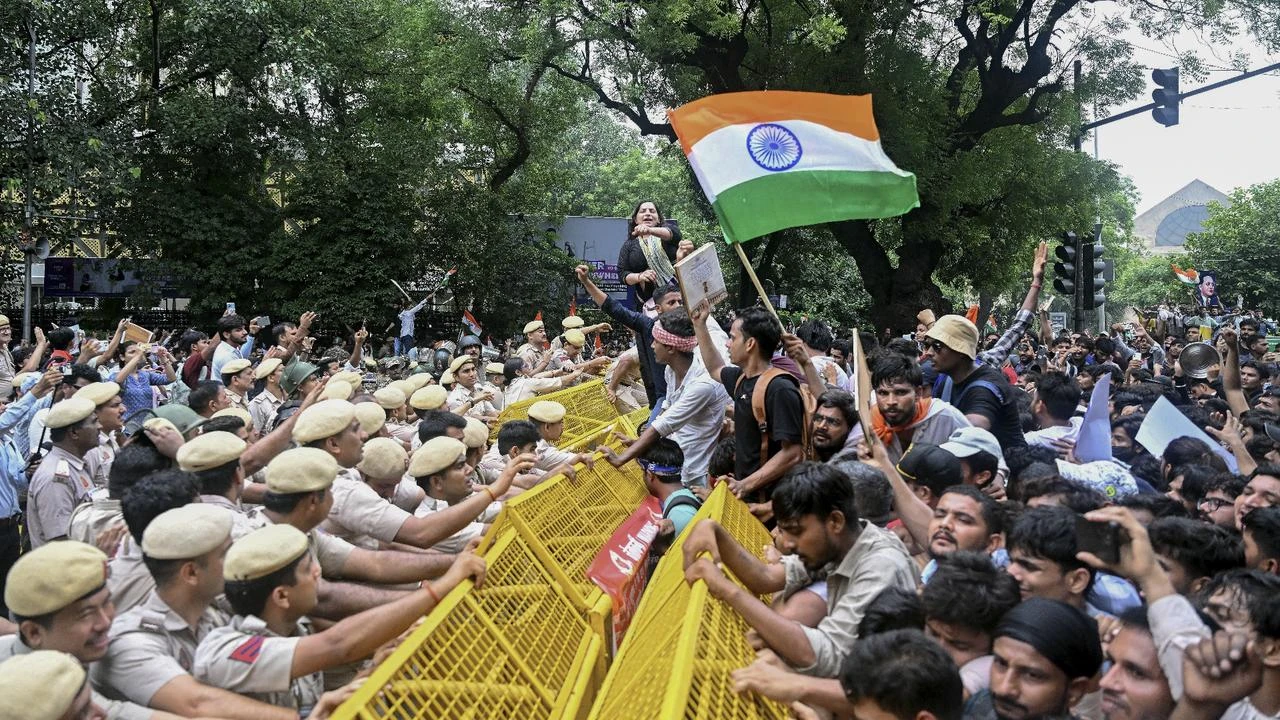 Police use tear gas as thousands march in New Delhi over exam irregularities