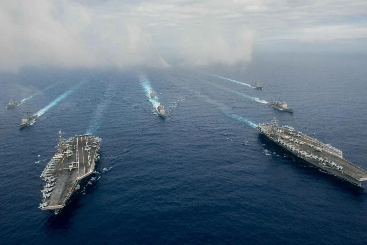 USS John C. Stennis (CVN 74) and USS Ronald Reagan (CVN 76) conduct dual carrier strike group operations in the U.S. 7th Fleet area of operations in the Indo-Pacific. (U.S. Navy photo)
