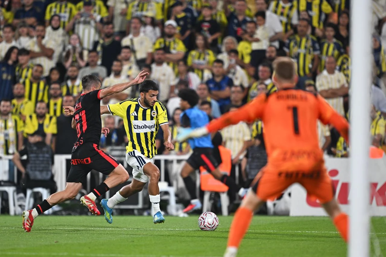 Fenerbahce's Oguz Aydin (right) and Gornik Zabrze's Michal Sacek (61) challenge for the ball during the UEFA Champions League second qualifying round first-leg match at Chobani Stadium in Istanbul, Türkiye, on July 21, 2026. (AA Photo)