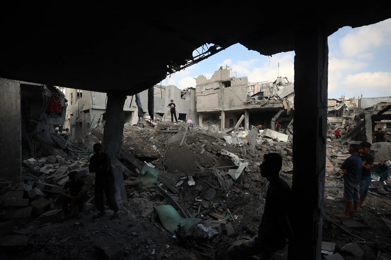 Palestinians inspect the site of an Israeli strike at the Bureij refugee camp in central Gaza Strip, July 16, 2026. (AFP Photo)