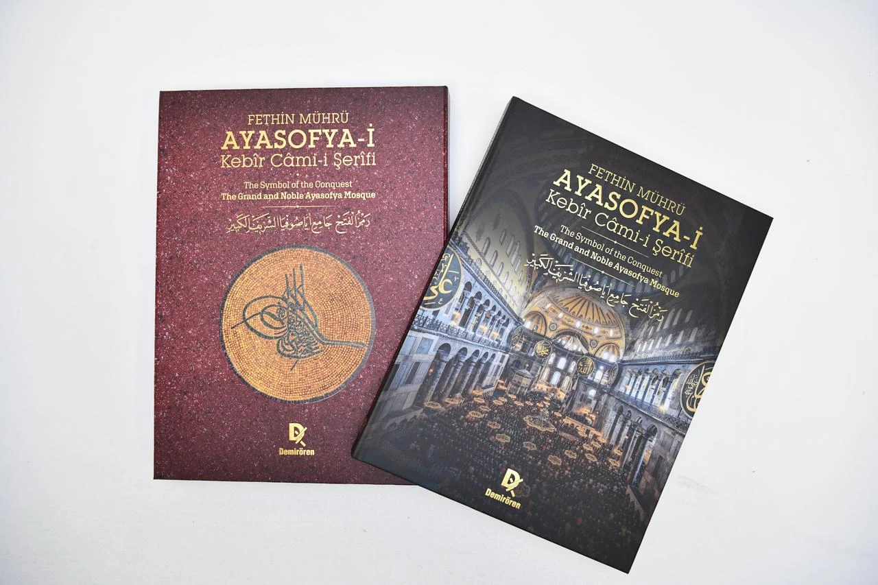 The trilingual volume "The Symbol of the Conquest: The Grand and Noble Ayasofya Mosque" and its presentation case feature images and design elements inspired by Hagia Sophia. (AA Photo)