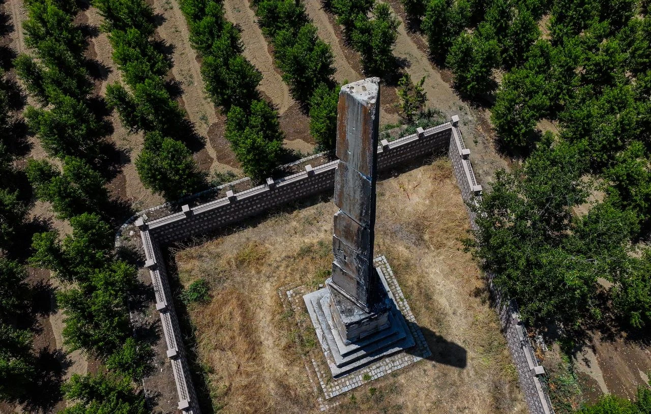 An aerial view shows the nearly 2,000-year-old Roman monumental tomb surrounded by orchards near Iznik, Bursa, Türkiye, July 22, 2026. (AA Photo)